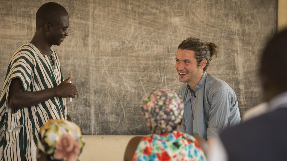 Student interacting with locals in Ghana