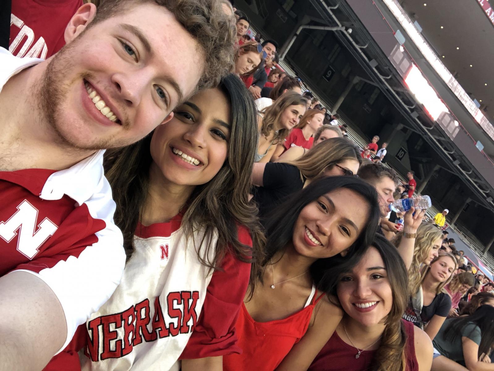 Anja with friends at a Husker sports game