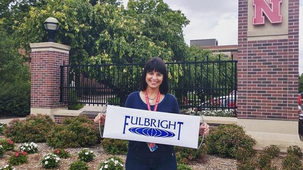 Former Fulbright scholar Ana Maciel stands in front of the Nebraska Union during a campus tour for the Fulbright English for Graduate Studies Program